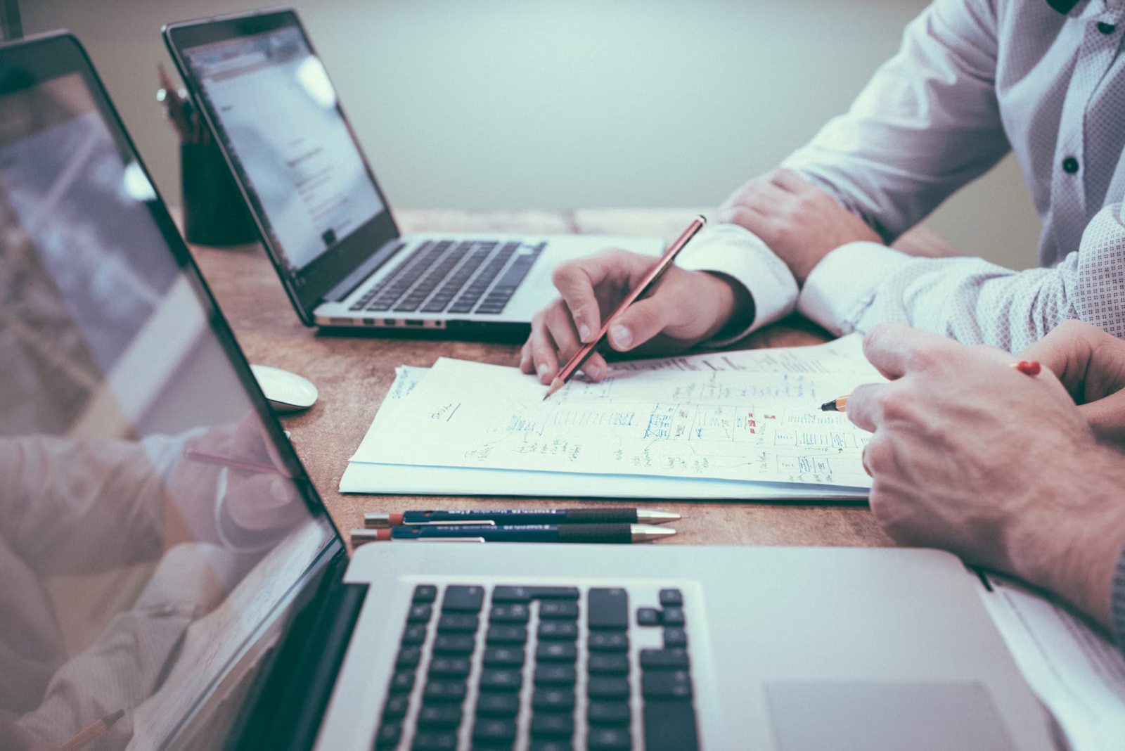 Business professional reviewing spreadsheet data — signs your business has outgrown Excel